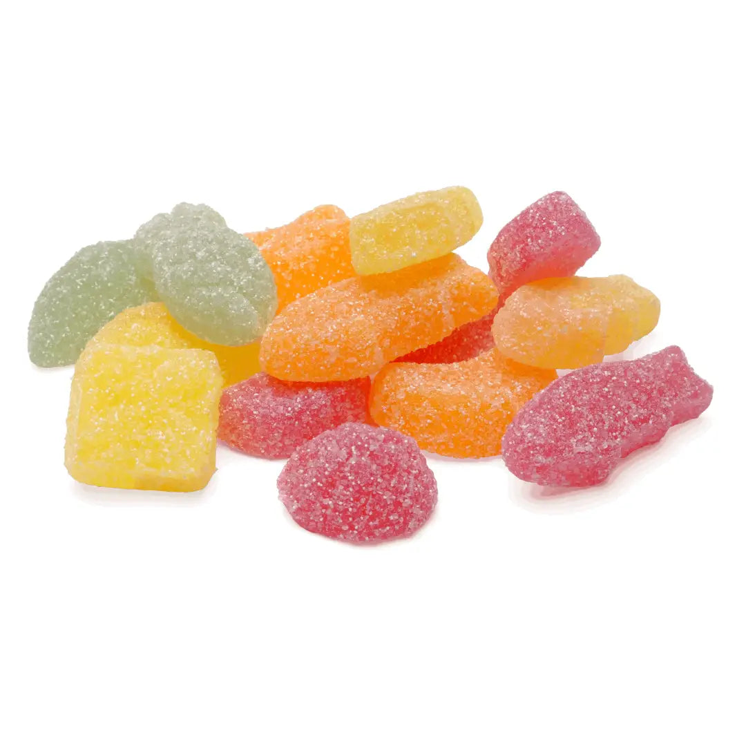 Different pieces of Swedish candy in the shape of different fruits, coated in sugar, in red, orange, yellow and green.