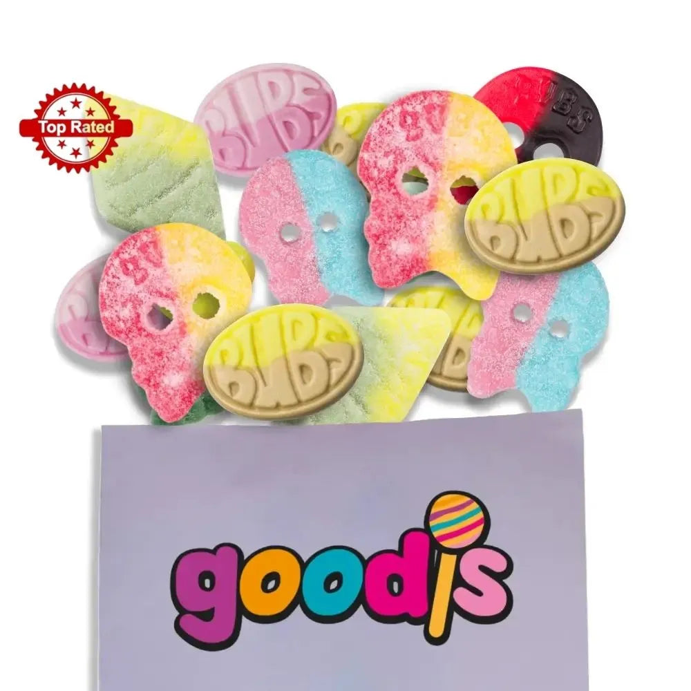 A mix of Swedish candy from the brand Bubs. The candy is in different colors and shapes, including rhombs, skulls and ovals, in a purple candy bag with "Goodis" written in the front.
