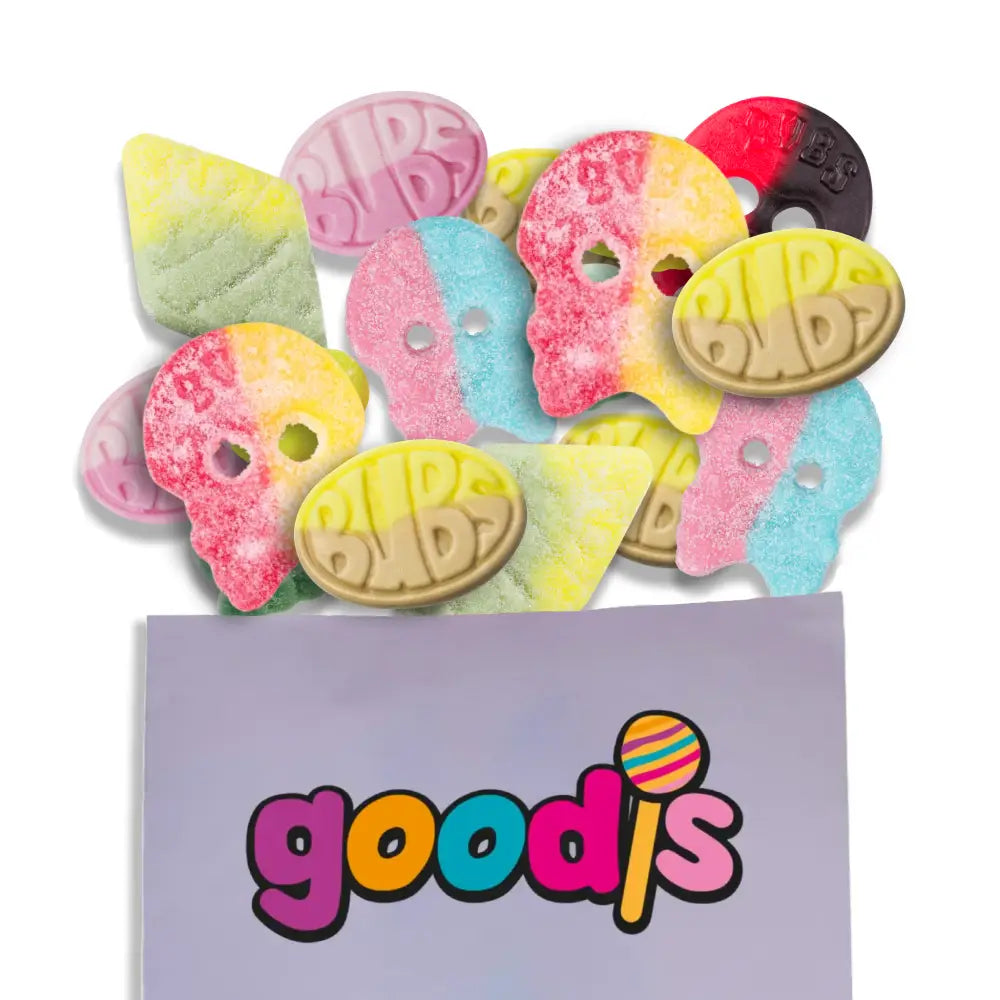 A mix of Swedish candy from the brand Bubs. The candy is in different colors and shapes, including rhombs, skulls and ovals, in a purple candy bag with "Goodis" written in the front.