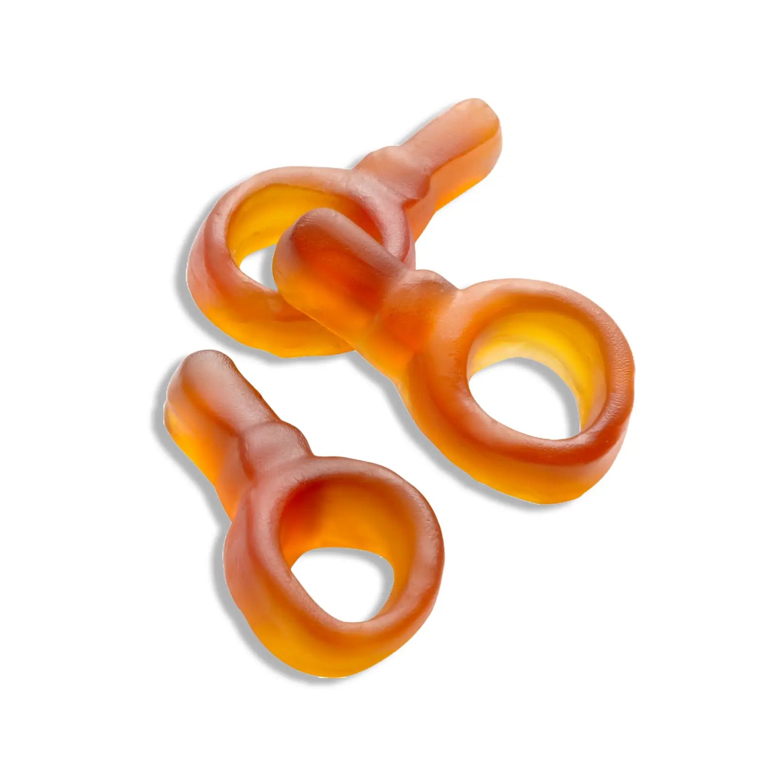 Three pieces of Swedish candy, in the shape of brown pacifiers.