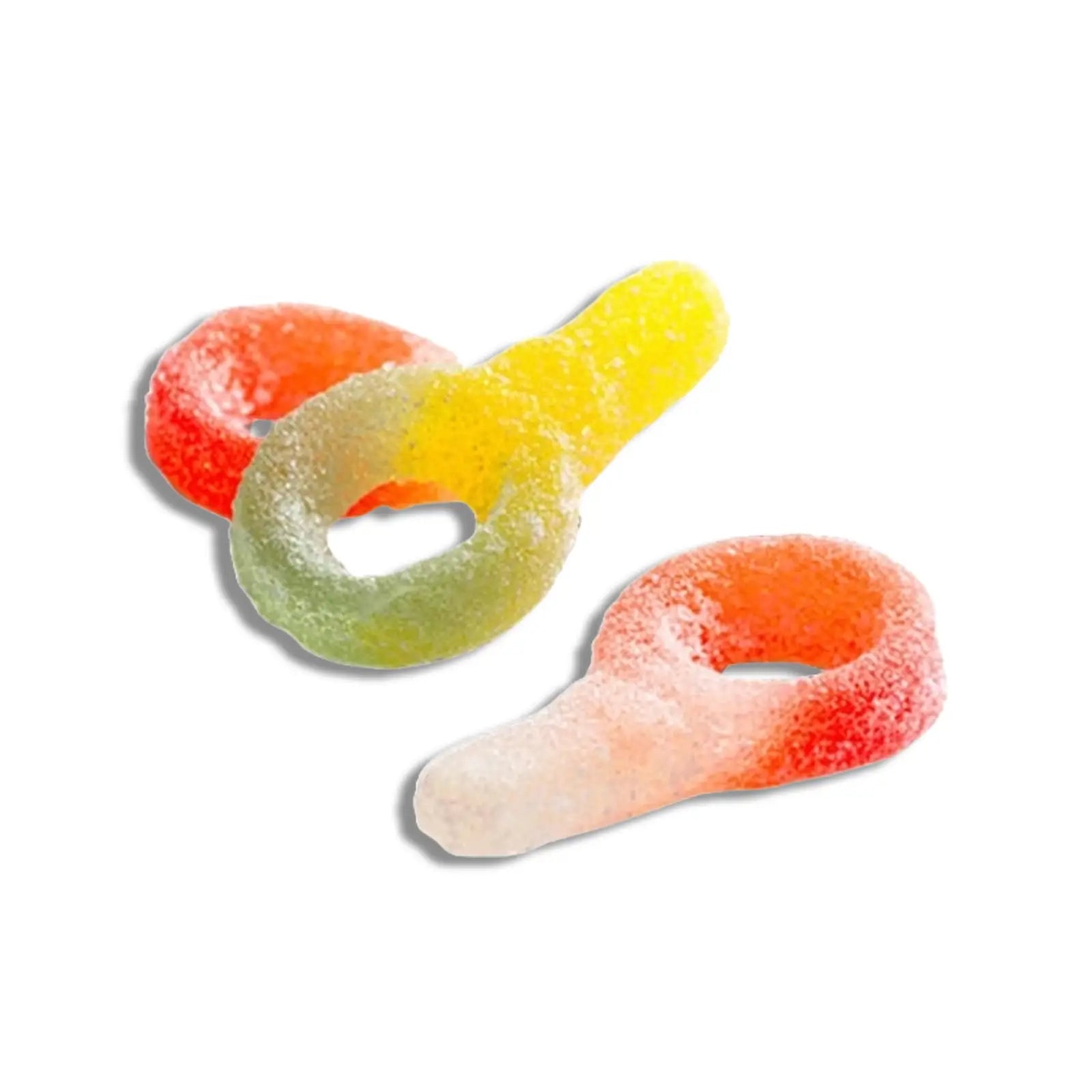 Three pieces of Swedish candy shaped like pacifiers, coated in sugar, in in green, yellow, orange and white.