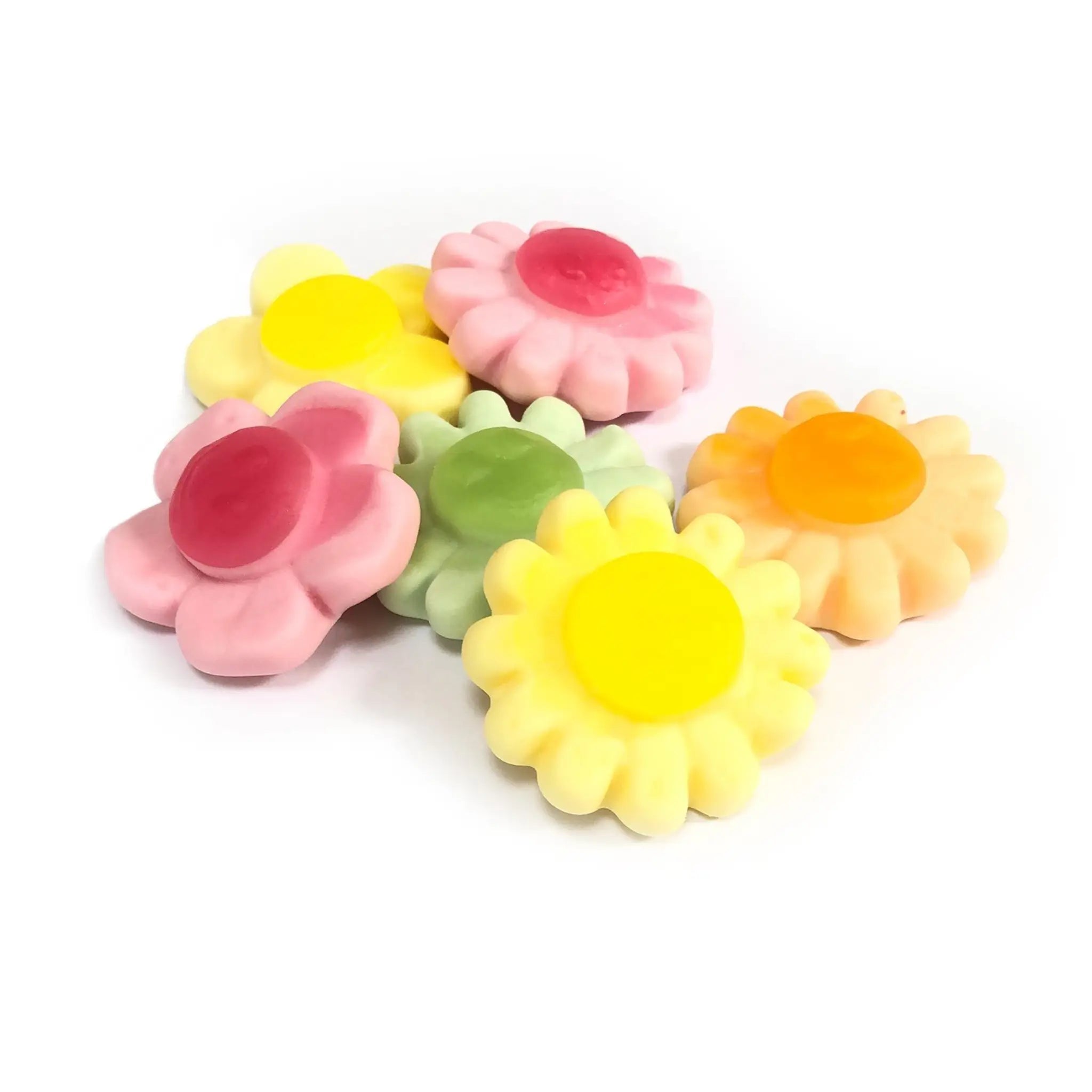 Five pieces of candy in the shape of flowers in pink, orange, green and two in yellow.