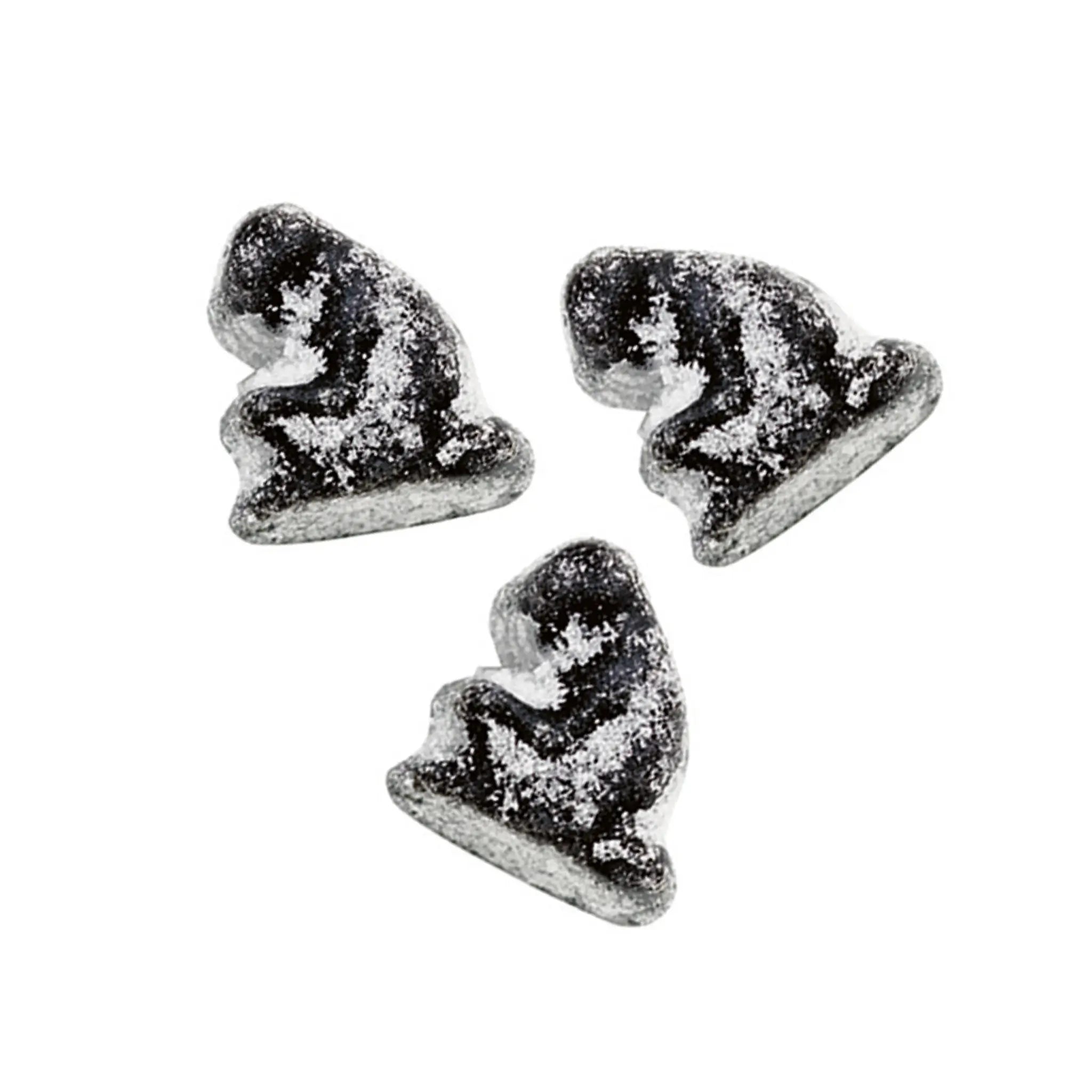 Three pieces of Swedish candy in the shape of black monkeys coated in sugar.