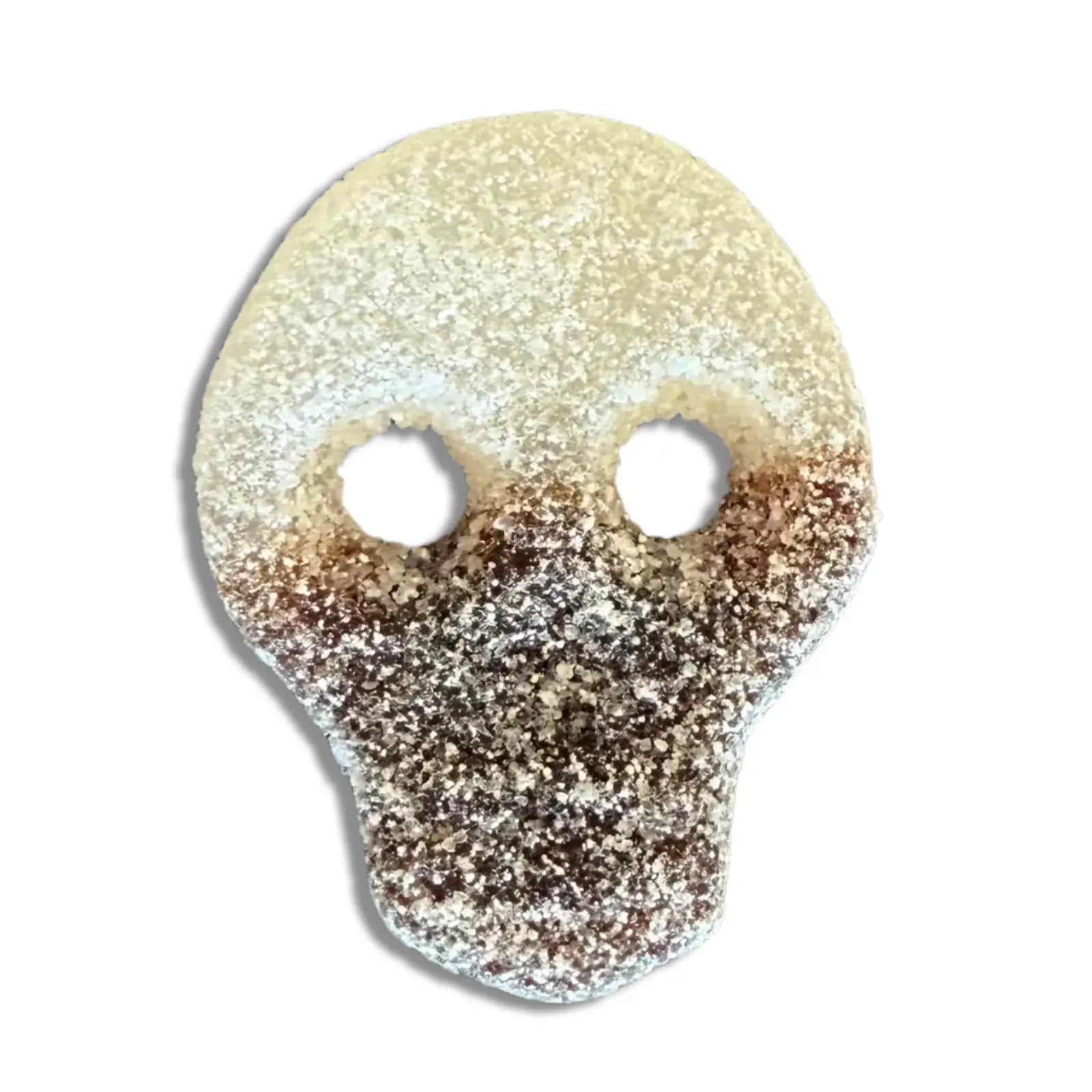 Swedish candy in the shape of a skull in white and brown, coated in sugar.