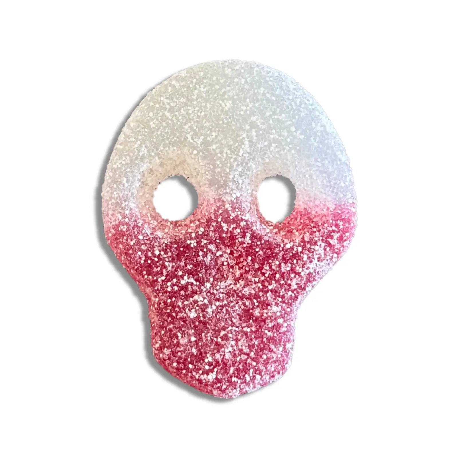 Swedish candy in the shape of a skull, white and red, coated in sugar.