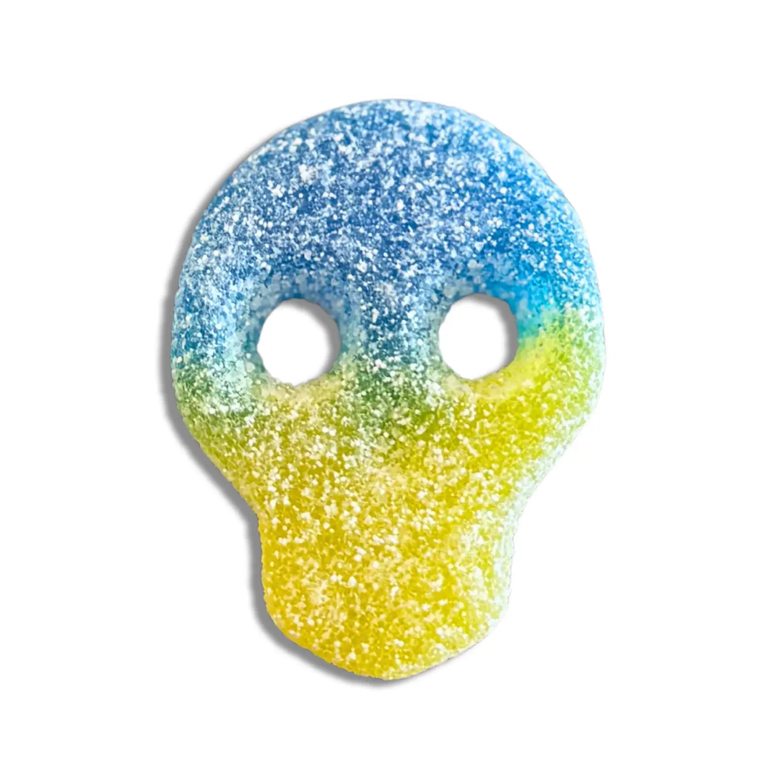 Swedish candy in the shape of a skull, blue and yellow, coated in sugar.