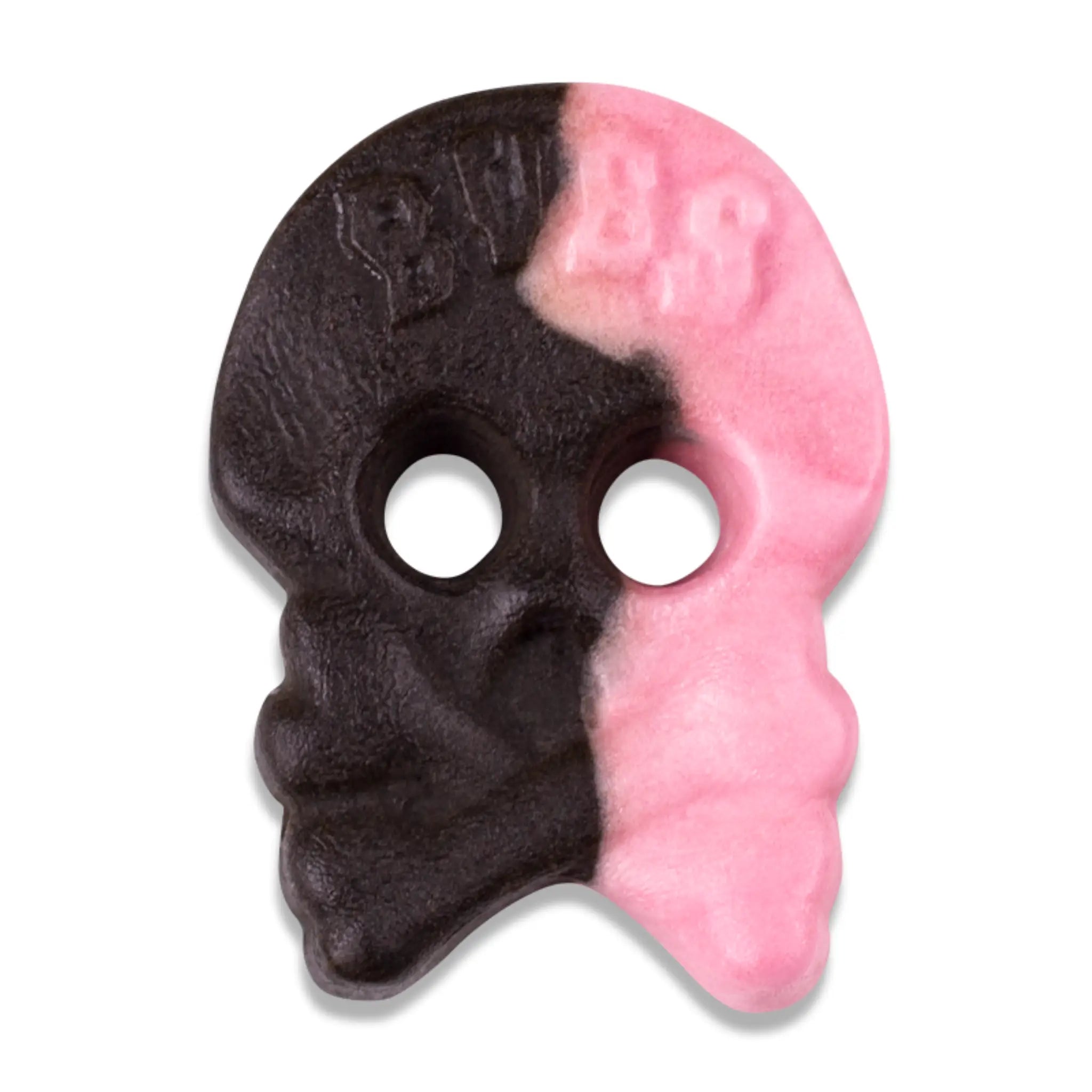 A piece of Swedish candy in the shape of a skull, partly in black and partly in pink.