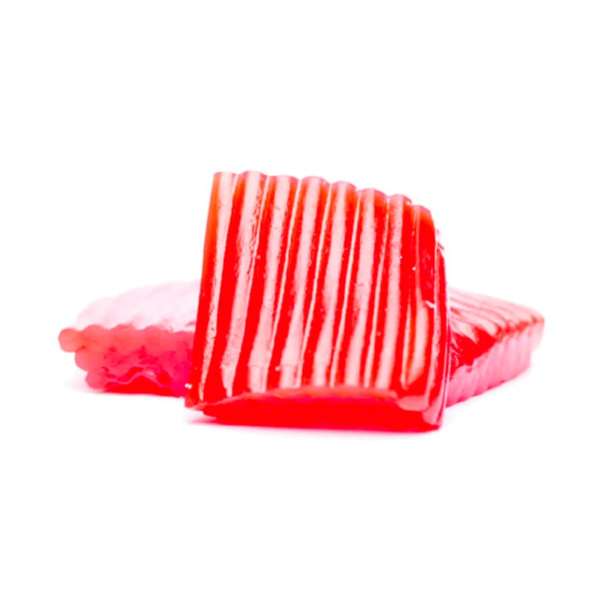 A piece of red Swedish candy in the shape of a carpet.
